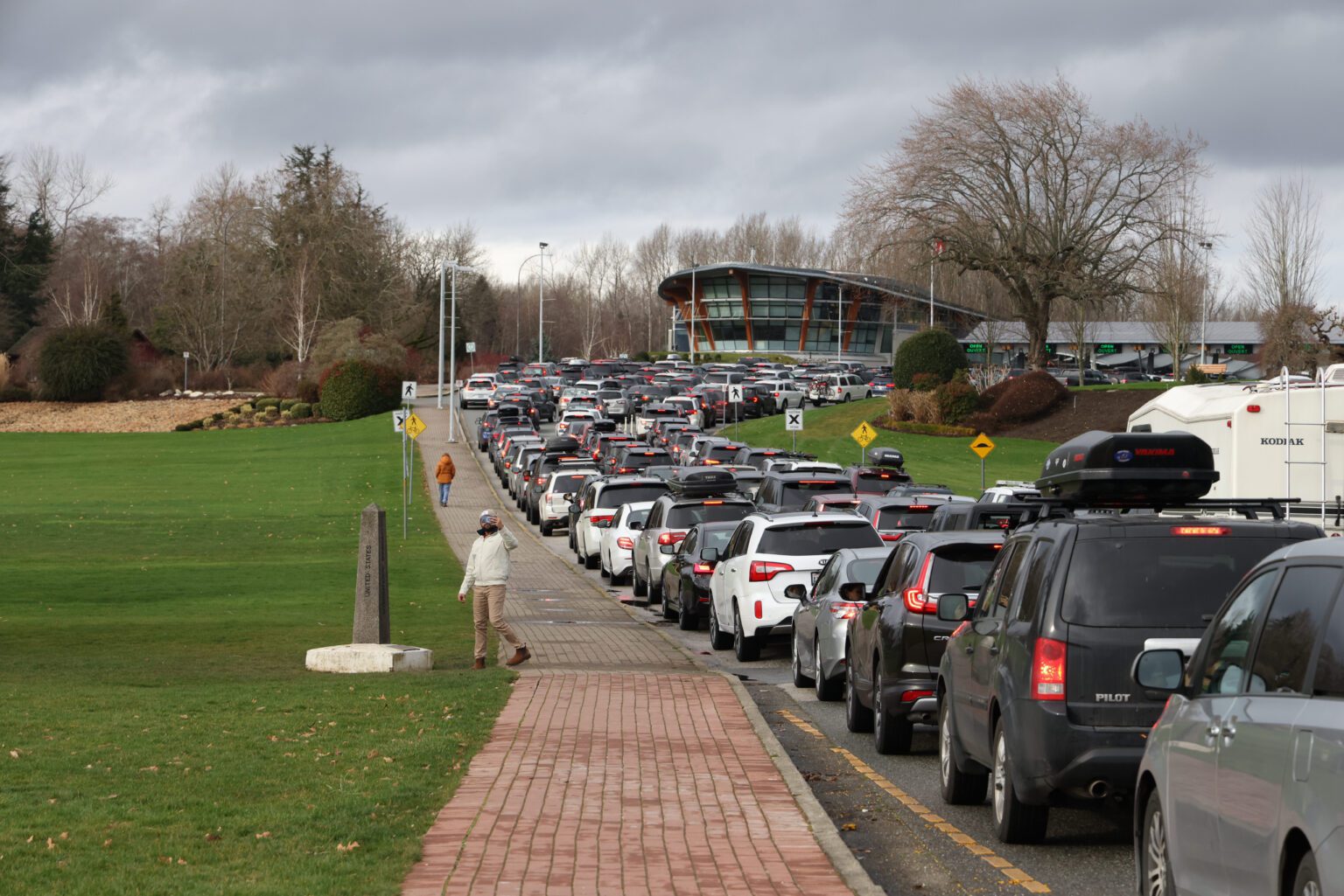 Lines of cars head to Canada and the Peace Arch border crossing in 2022 from Whatcom County. Personal vehicle border crossing volumes have not bounced back to pre-pandemic levels.