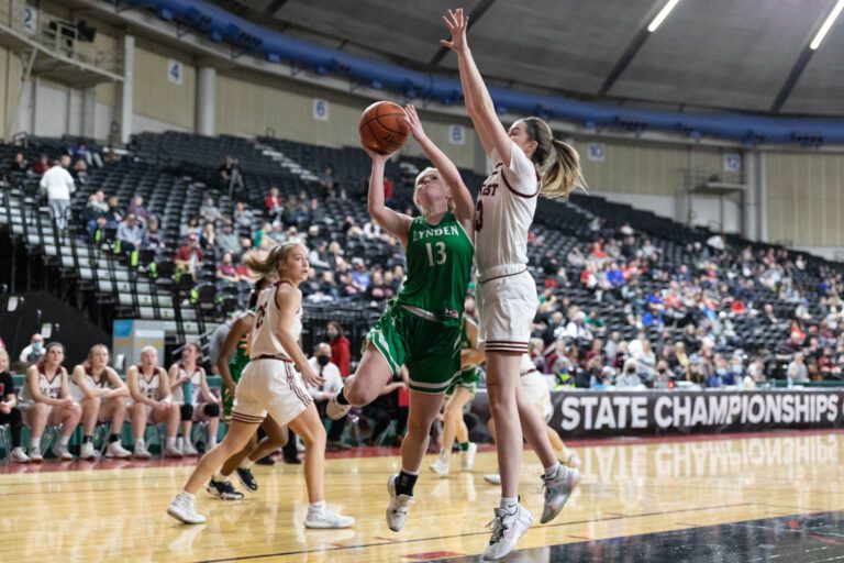 W.F. West forward Drea Brumfield swats away a shot attempt against Lynden's Adia Newcomb in the 2A State Tournament at the Yakima Valley SunDome March 2.
