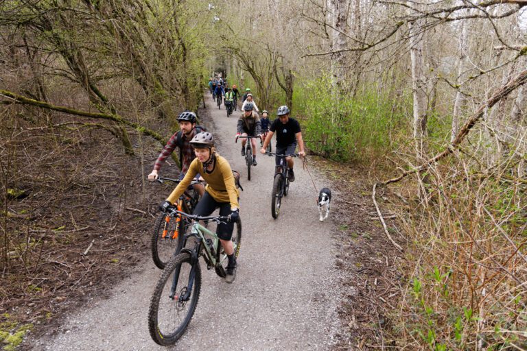 Bicyclists ride through the Hundred Acre Wood in March to bring attention to a proposed limit on bicycle use on the park's trails. The Bellingham City Council will hold a public hearing Aug. 29 on a master plan for Hundred Acre Wood.