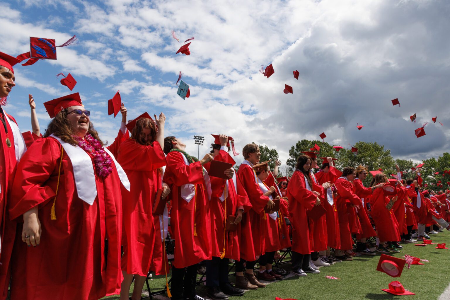 Graduates throw their caps in the air after the 2022 Bellingham High School graduation ceremony at Civic Stadium. Graduating seniors this year have the opportunity to compete in Cascadia Daily News' first essay contest.