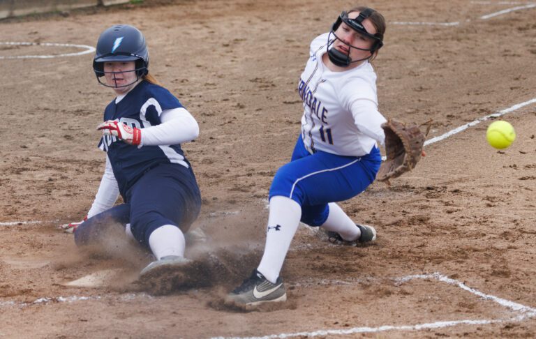 Squalicum’s Jasmine Meyer slides into home plate to score as Ferndale’s Mallory Butenschoen tries to make an out. Ferndale lost to Squalicum 3-0  on Wednesday.