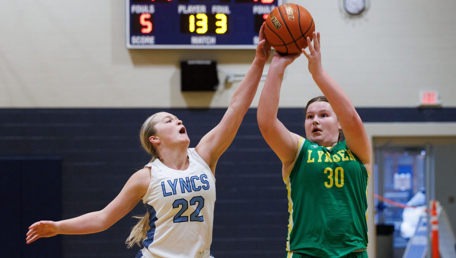 Lynden Christian’s Reganne Arnold blocks a shot by Lynden’s Payton Mills Feb. 4 in the fourth quarter of the Lyncs' 58-50 win over the Lions.
