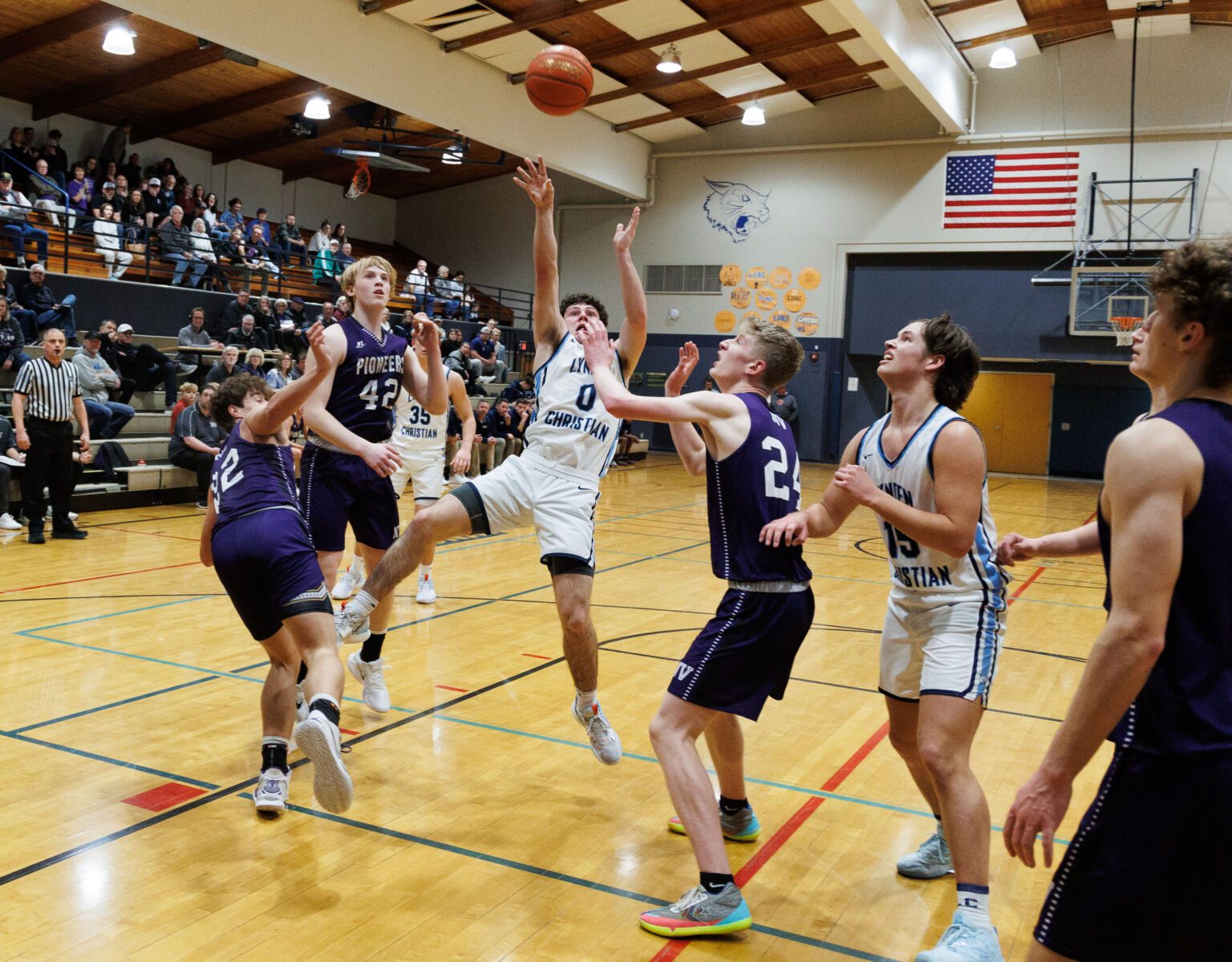 Lynden Christian’s Tyler Sipma makes the basket as he falls and gets fouled as the Lyncs beat Nooksack Valley 73-52 on Jan. 6. Sipma finished with 35 points in the game.