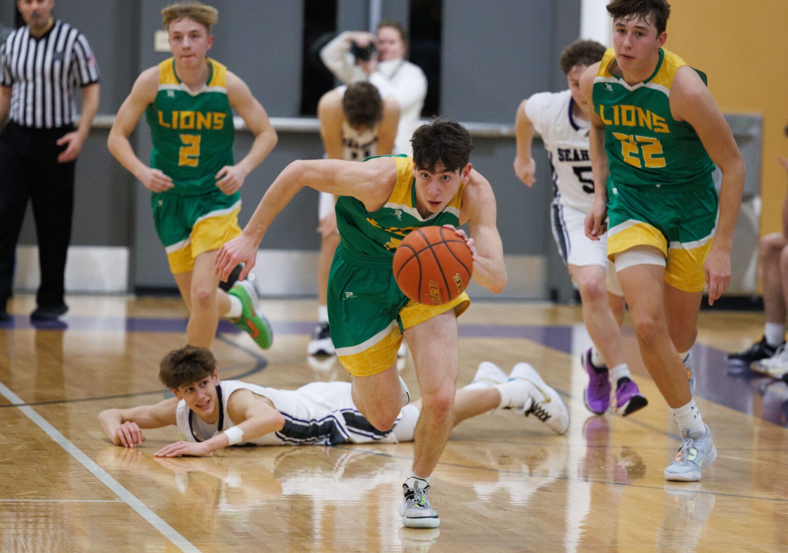 Lynden's Coston "Bubba" Parcher grabs the turnover by Anacortes' Davis Fogle in the final seconds of their game on Jan. 25 in Anacortes. Lynden beat Anacortes 78-73 via a strong second-half showing.