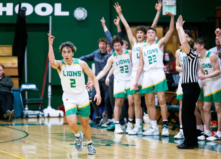 Lynden's Kaleo Jandoc scores a 3-point shot to put the Lions ahead as Lynden came back to win 58-48 over Port Angeles at Mount Vernon High School on Feb. 25.