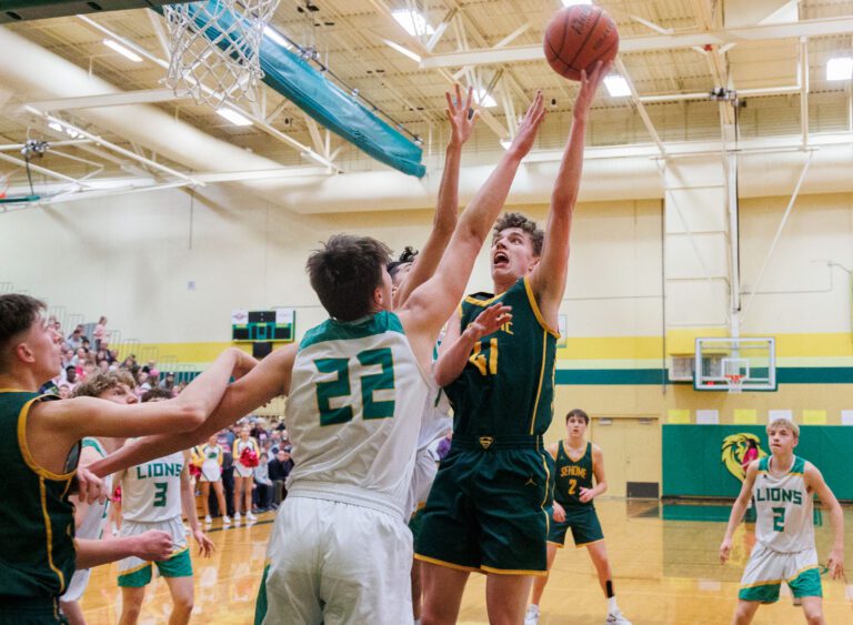 Sehome's Grant Kepley throws up a shot for two points as Sehome upset Lynden.