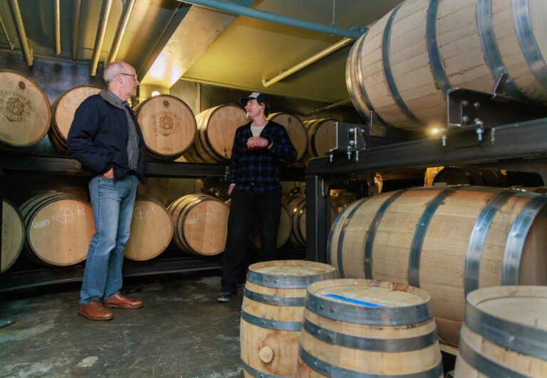 Surrounded by barrels of bourbon and rye whiskey