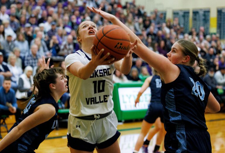 Nooksack Valley's Lainey Kimball puts up a shot as Lynden Christian's Tabby DeJong tries for the block. The Pioneers beat the Lyncs 55-45 in the 1A District 1 Championship game Feb. 11 in Lynden.