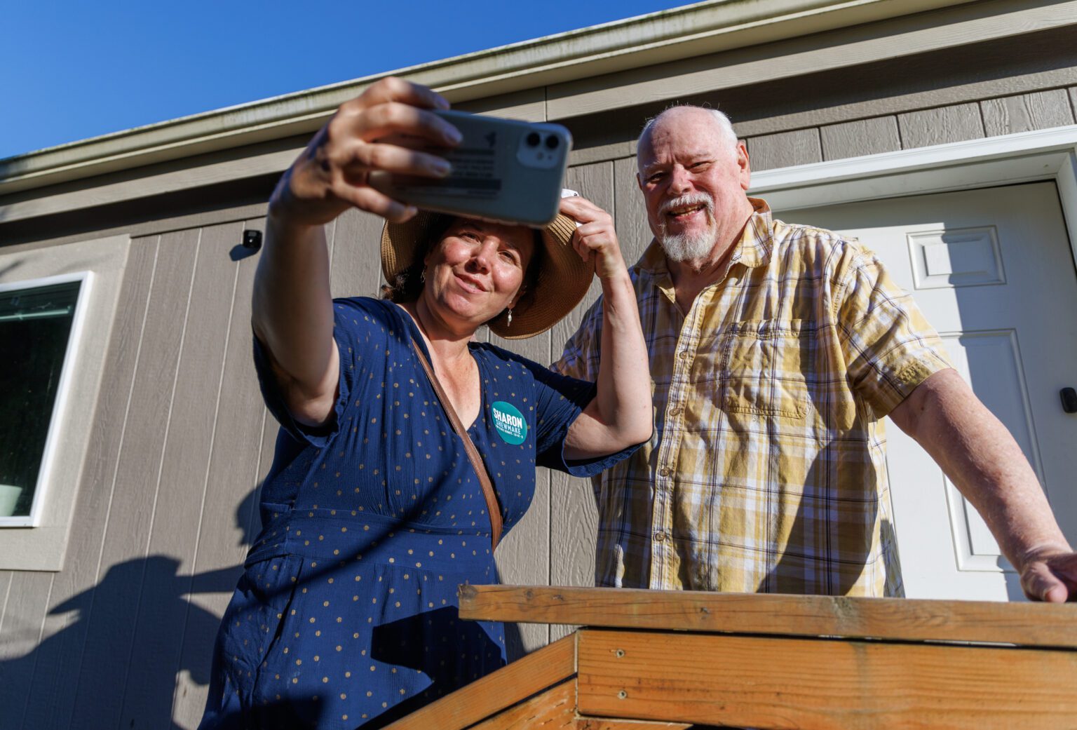 Sharon Shewmake takes a selfie with supporter Steve Hodel while campaigning in Birch Bay on July 27. Shewmake and her team knocked on more than 20