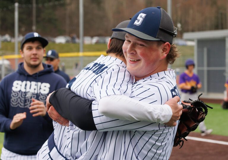 Pitcher Eli Knowlton gets a hug after his 14 strikeouts led Squalicum to a 2-0 win over Highline on March 12.