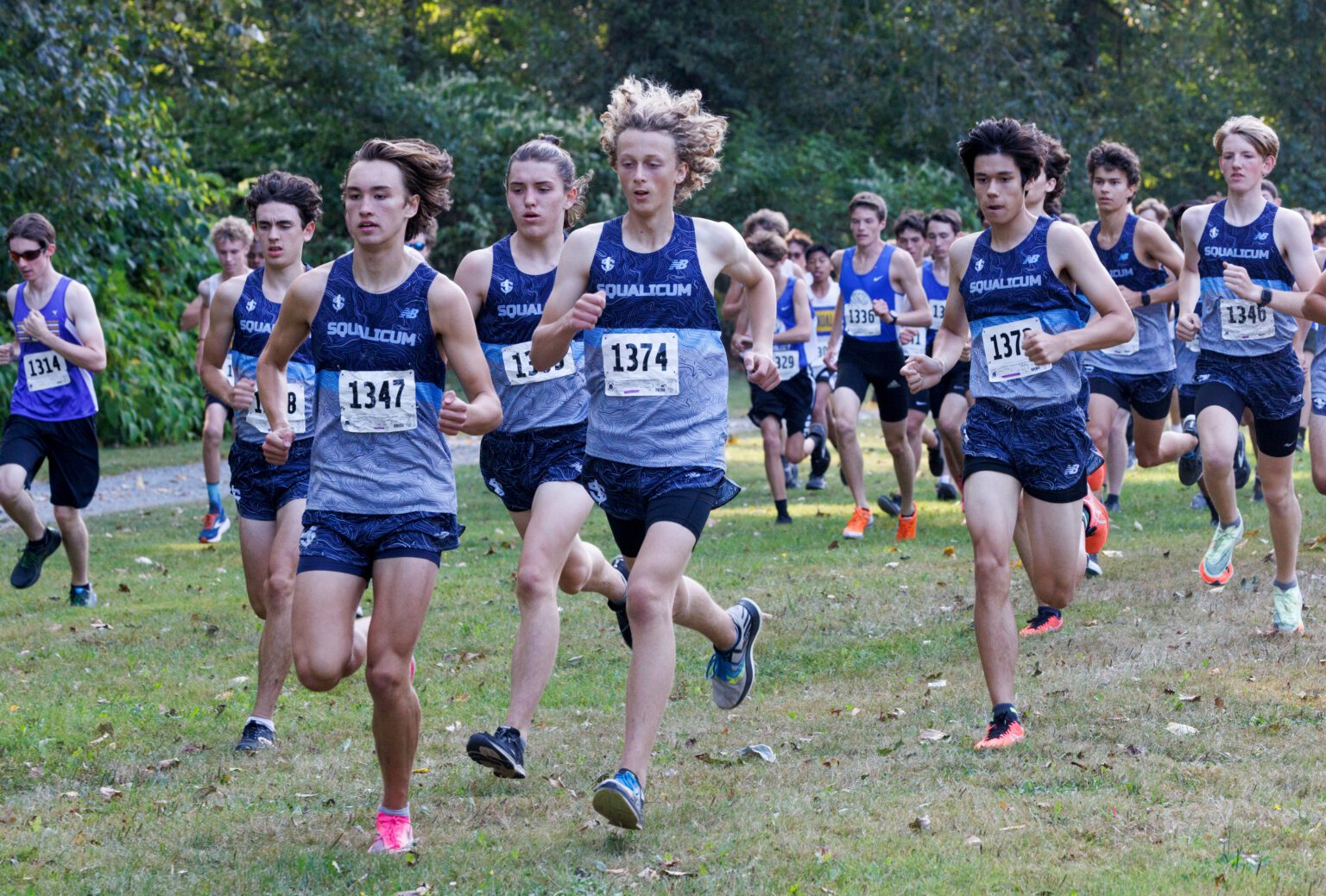 Owen Voight (1374) and the Squalicum boys cross country team takes the lead in their race against Sedro-Woolley and Ferndale at Hovander Homestead Park on Sept. 14.