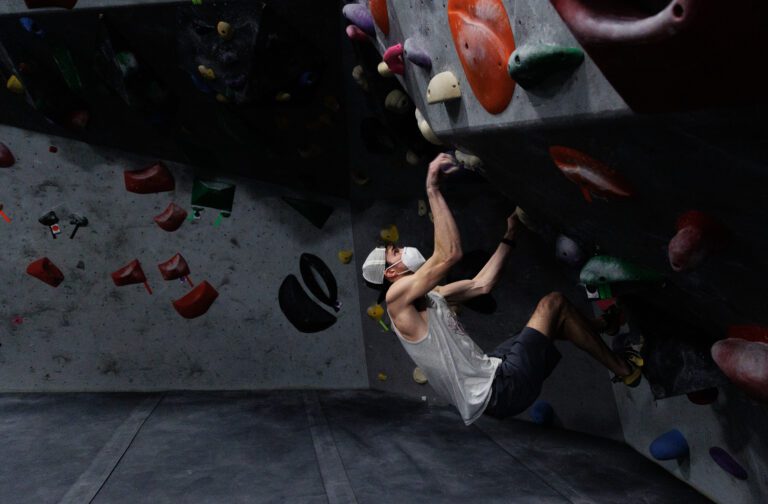 Rainer Luhrs looks for a hold on an overhanging area at Bellingham's VITAL Gym on Jan. 13.