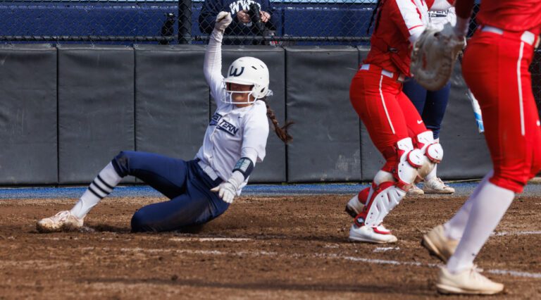 Western Washington University’s Taylor Khorrami slides in for a run March 11 as Western Washington University beat Simon Fraser University 2-1 in the first game of a doubleheader.