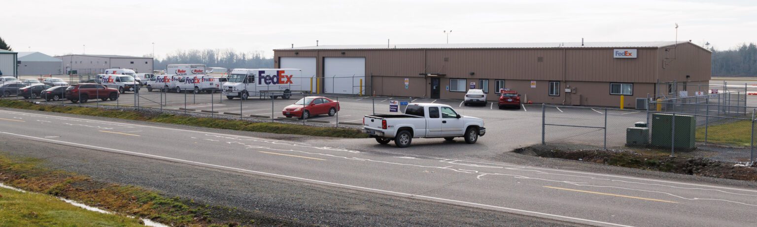 A truck pulls into the lot at the FedEx regional distribution center on Saturday in Burlington