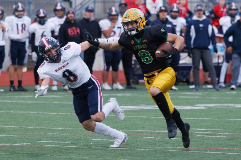 Lynden's Isaiah Stanley catches the ball and runs in for a 26-yard touchdown reception in the first quarter as Lynden beat Black Hills 54-7 to advance to the state quarterfinals on Friday.