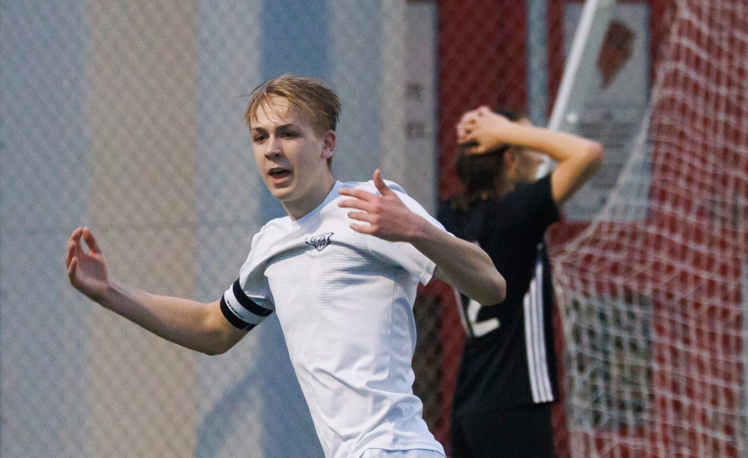Squalicum’s Xander Koenig celebrates while a Bellingham player reacts to Koenig’s second goal May 1 as Squalicum beat Bellingham 3-1 in Bellingham.