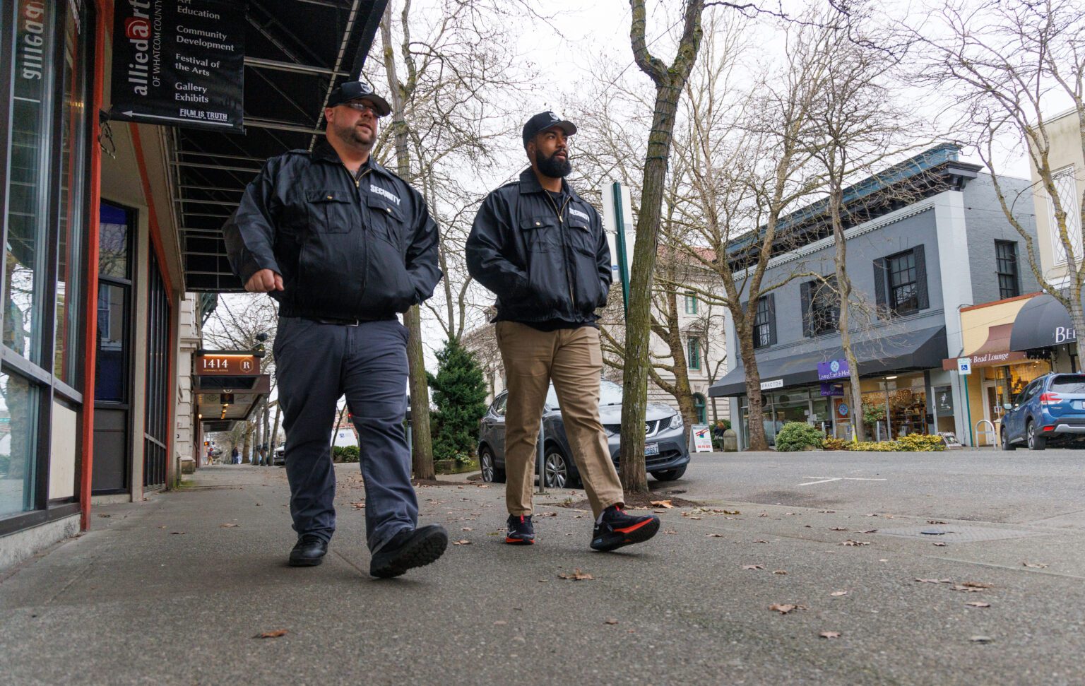 Chris Nelson, left, and Caleb Rodriguez from Risk Solutions Unlimited patrol downtown Bellingham on Feb. 2. Bellingham contracted with the security company to provide 24/7 service.