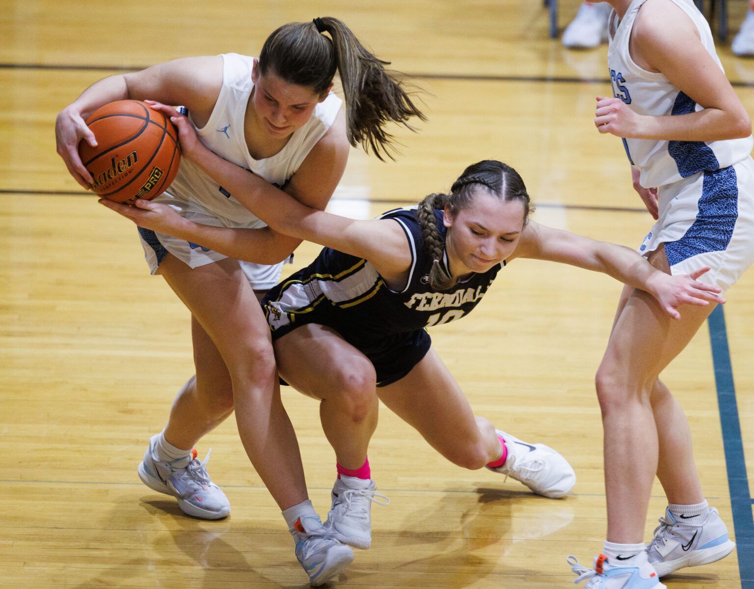 Lynden Christian's Grace Hintz steals the ball from Ferndale's Ellie Ochoa Jan. 28 in the second quarter of a Northwest Conference matchup at Lynden Christian High School. The Lyncs won 53-38.