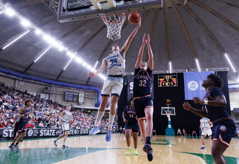 Lynden Christian's Andrew Hommes gets the put-back shot as Lynden Christian beat Life Christian Academy 53-49 to advance to the championship game of the 1A boys basketball championships.