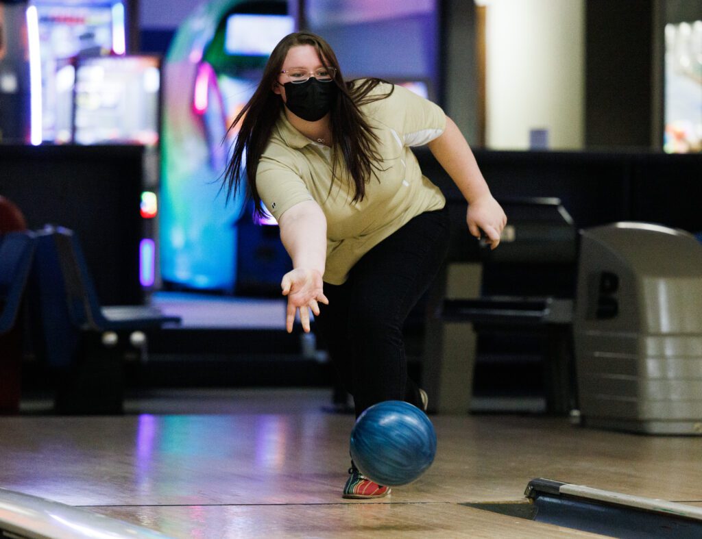 Meridian bowler Lexi Garvin practices as she lets her blue bowling ball down the bowling lane.