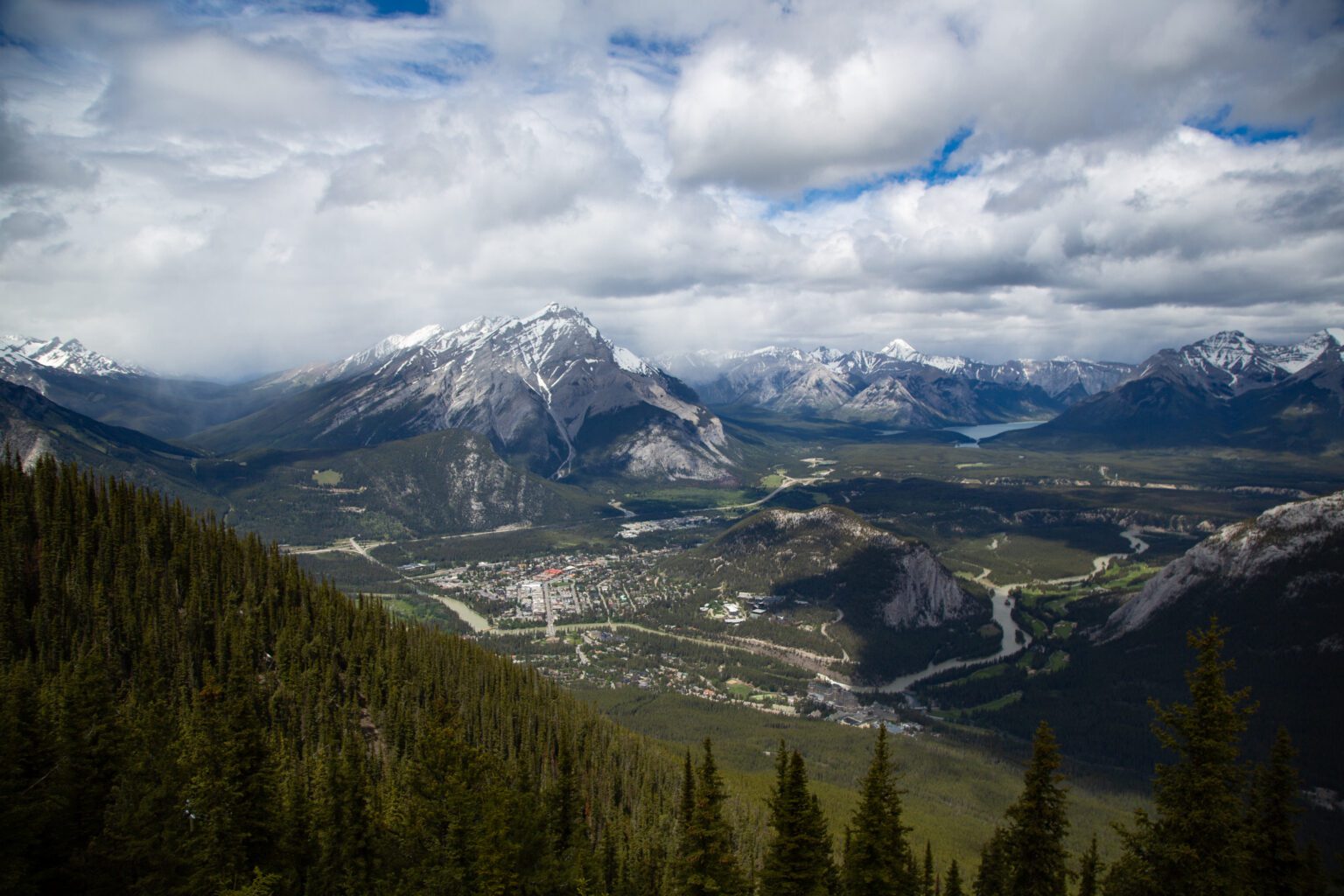 Clouds filter into the Bow River Valley above the town of Banff