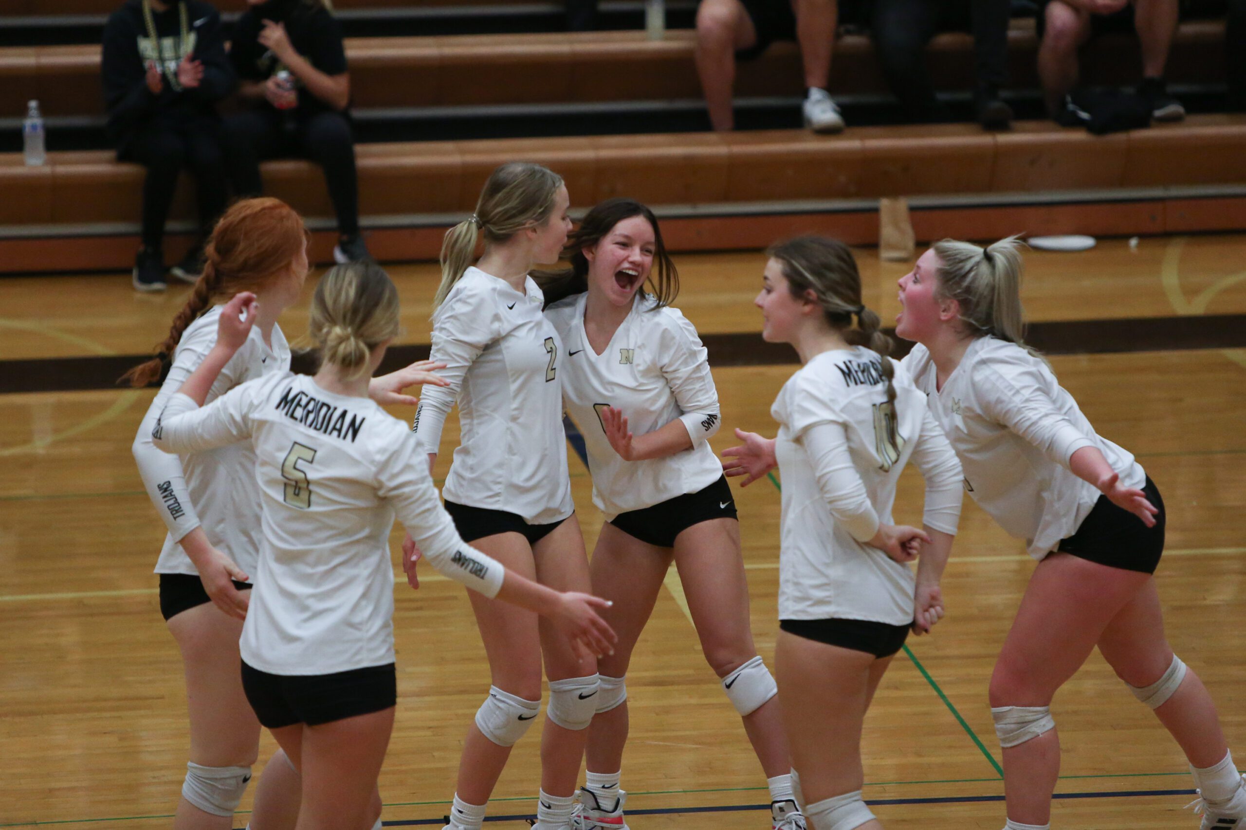 The Meridian volleyball team celebrates a point in their match against Lynden on Oct. 19