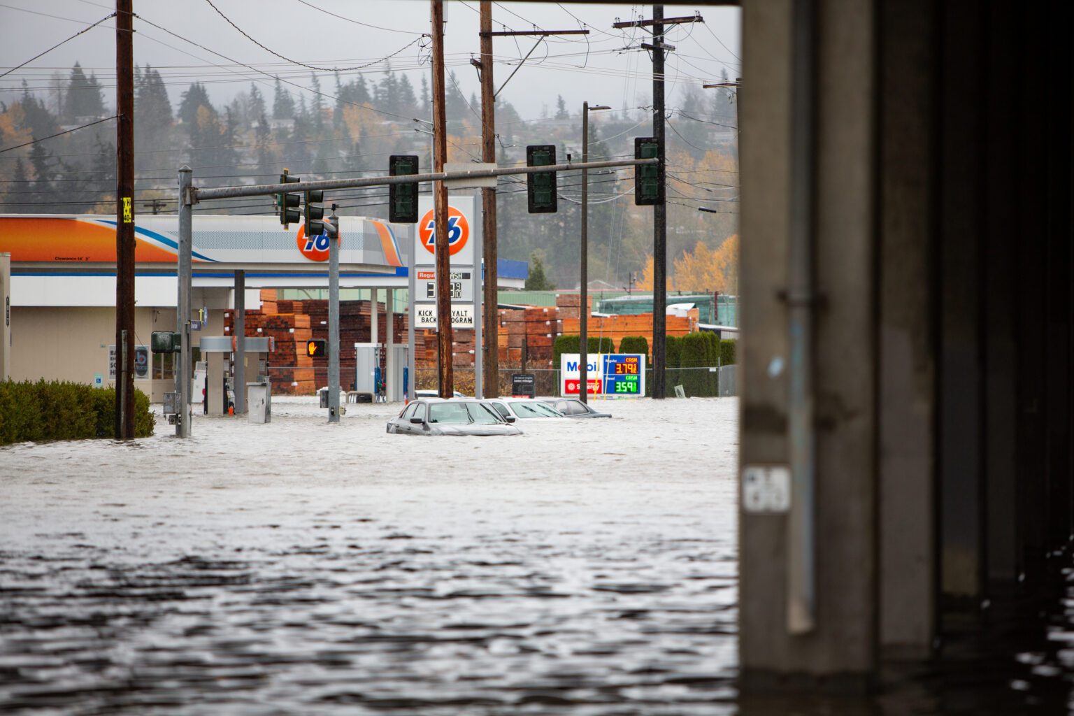 Water floods Iowa Street below Interstate 5 in Bellingham in November 2021. A Washington state House bill would establish a state emergency medical reserve corps. The network of volunteers could be deployed to respond to natural disasters