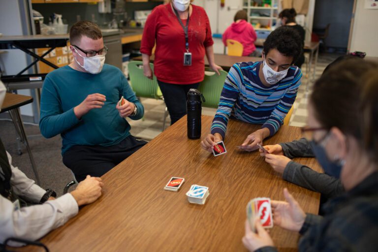 Community Transitions students play Uno during a break on Jan. 21.