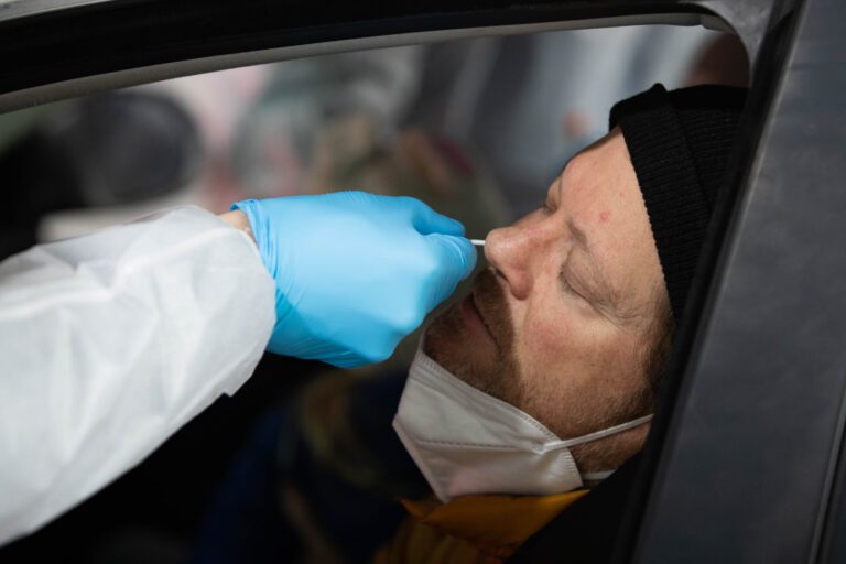 David Powers has his nose swabbed to test for COVID-19 at Northwest Laboratory's Bellingham Airport test site Tuesday.