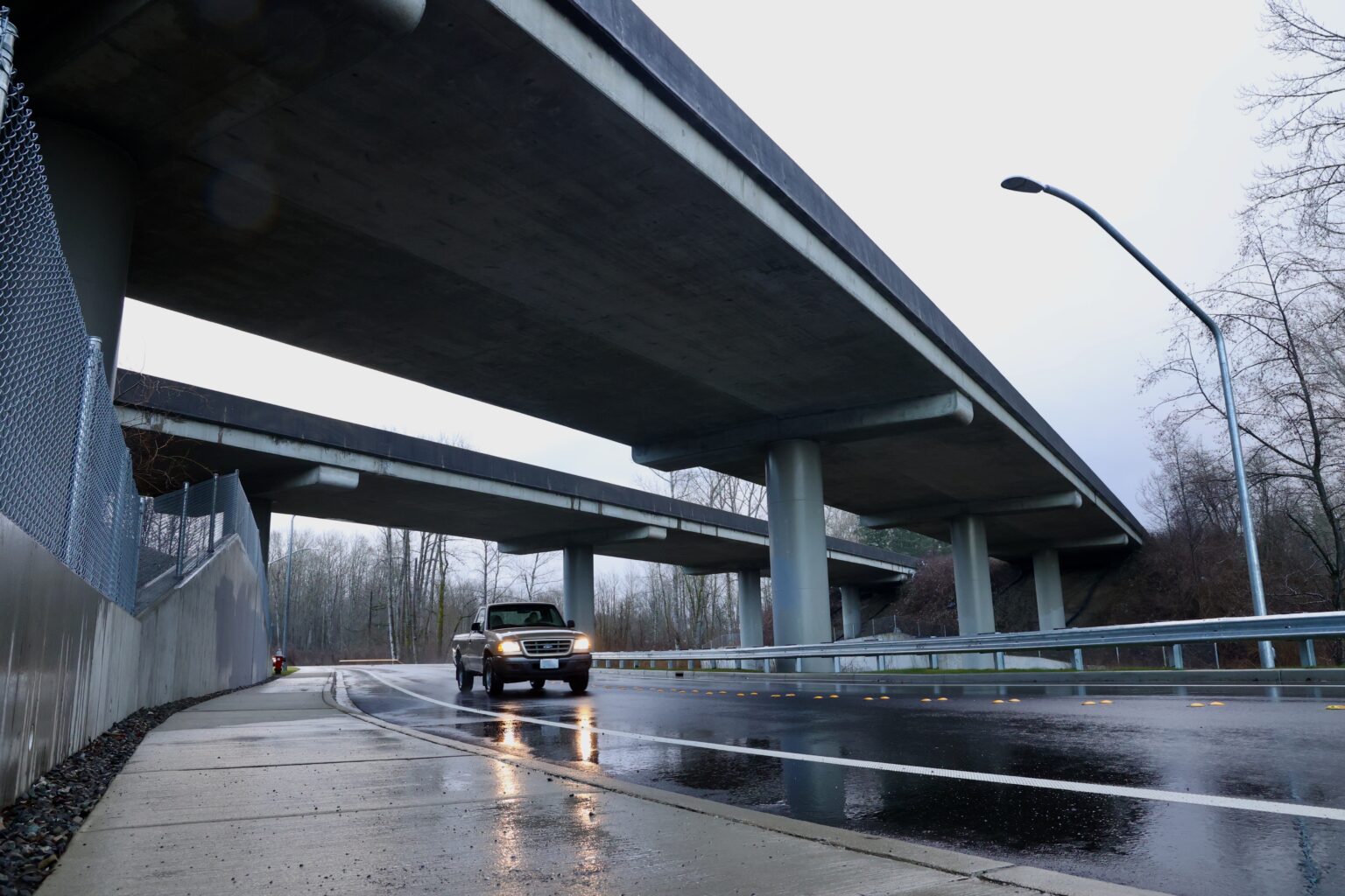 A truck passes under I-5 on the new Birchwood Avenue connector route.