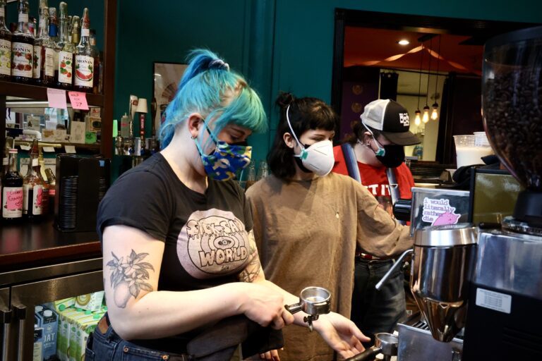 Black Drop employees brew drinks for customers on Feb. 3. The Whatcom County Health Department is again encouraging people to wear masks indoors to reduce the risk of spreading a triple threat of respiratory illnesses.
