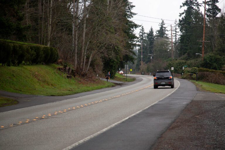 A car heads south on Samish Way near the scene of a Feb. 11 hit-and-run collision. A car struck Hartwell Mitchell