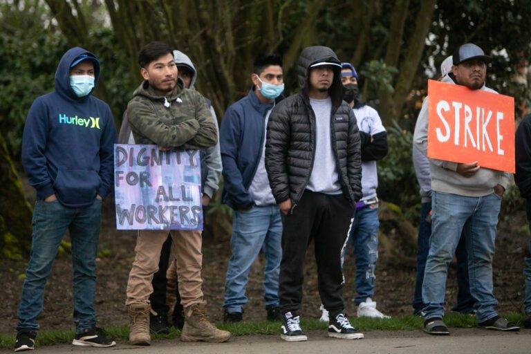 Washington Bulb workers form a picket line March 23 along Best Road near Mount Vernon. Some employee demands were met in an agreement signed March 30.