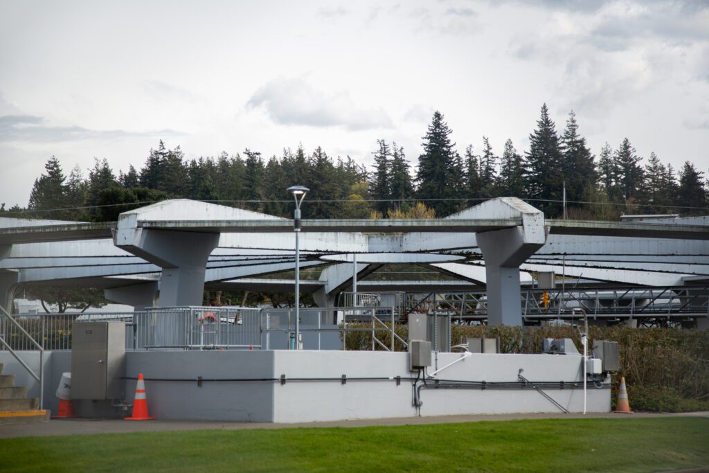 The Post Point Wastewater Treatment Facility surrounded by forests and dense bushes.