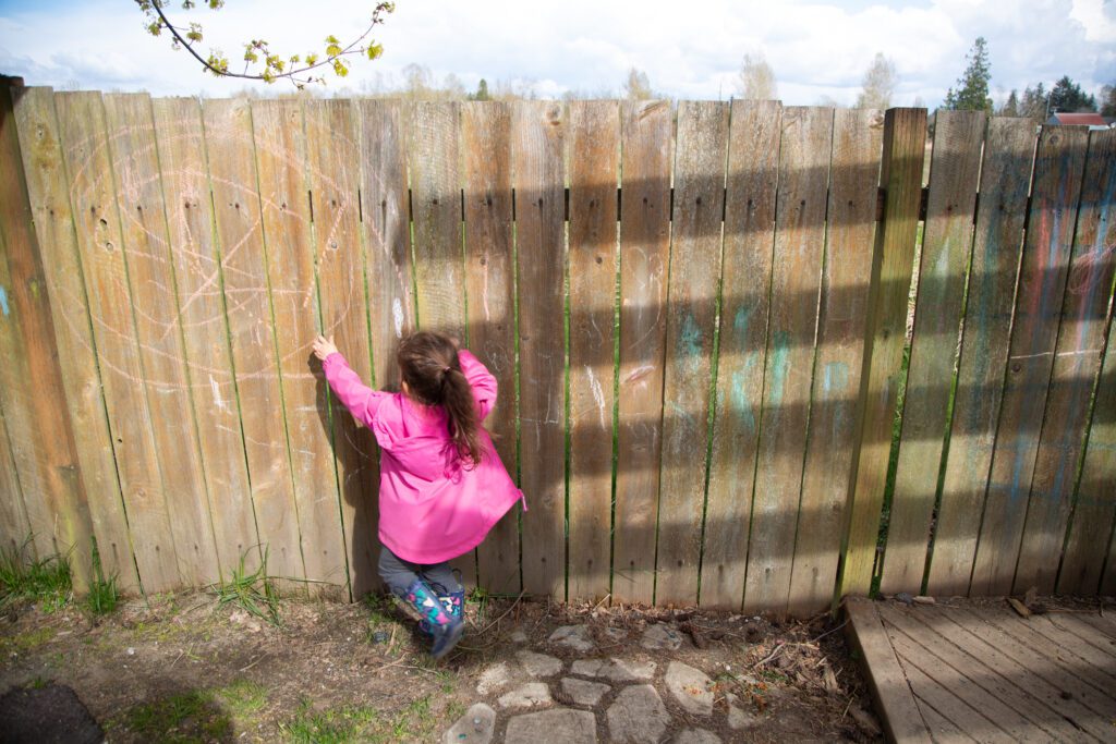 A child plays outside at Lil' Sprouts Child Care Center in Blaine in April 2022.