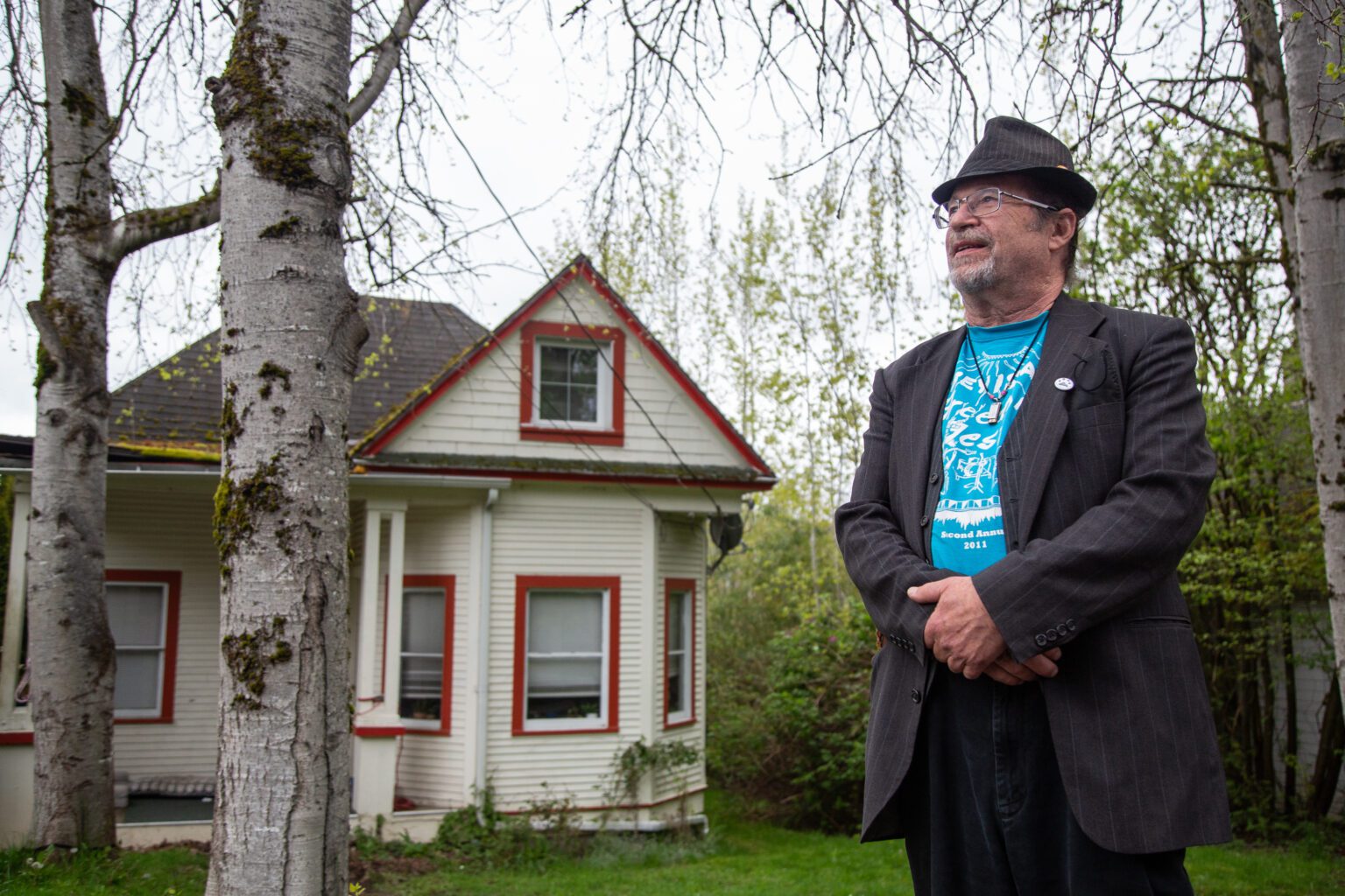 Andy Koch stands outside of his former home on 21st Street in Bellingham. He rented the home for several decades until his landlord died suddenly in 2018. Koch re-entered an unfamiliar world of rentals