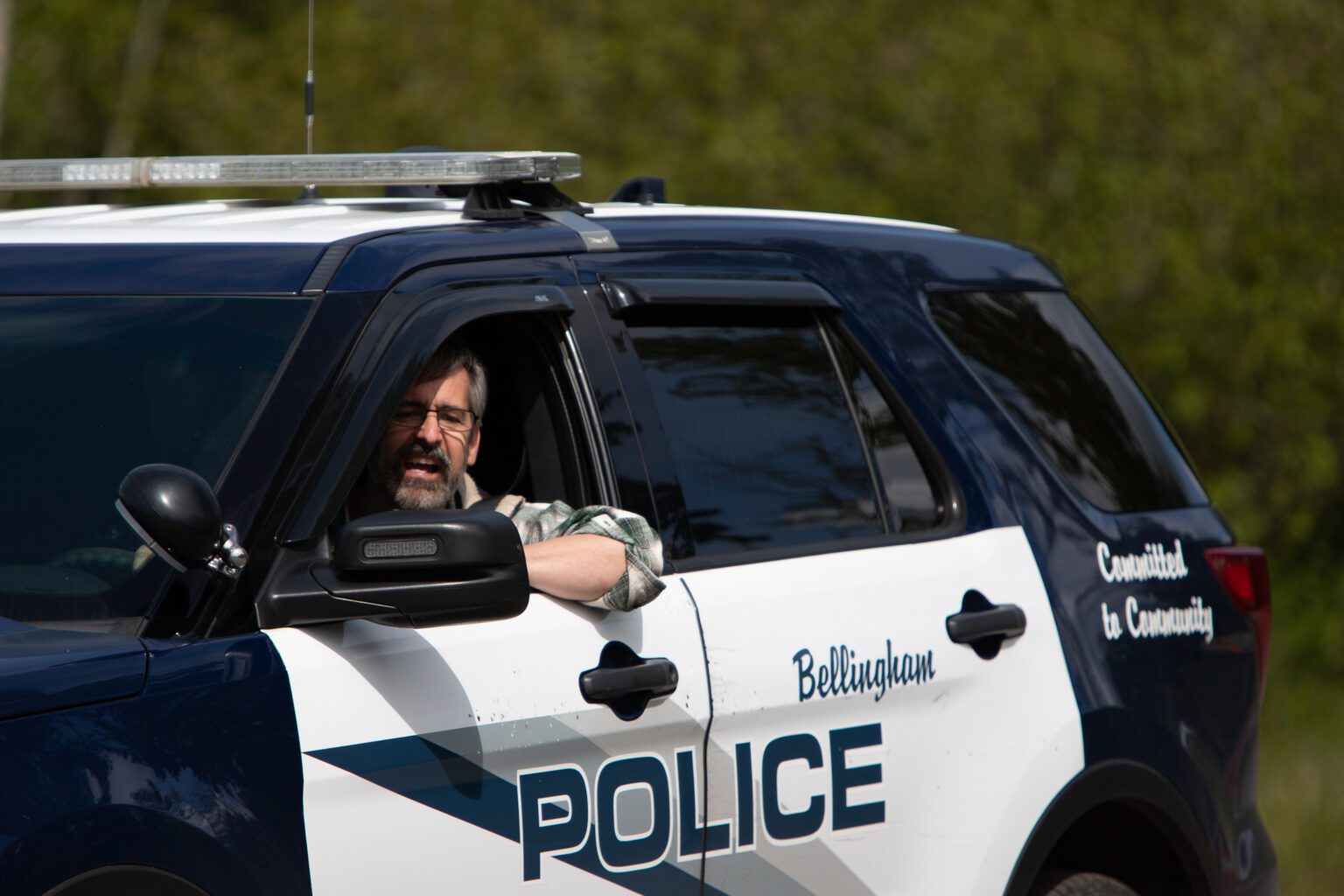 Bellingham City Council member Michael Lilliquist drives a police vehicle in a backing drill in May. Mayor Seth Fleetwood said staffing shortages in the city's police department are not due to a lack of budget