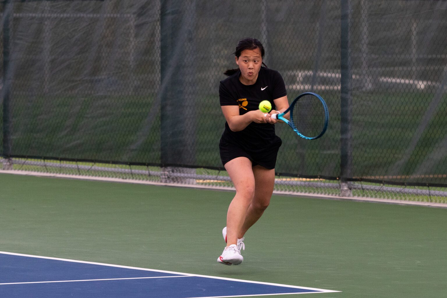 Sehome's Erin Lin hits back a serve in the singles consolation final against Squalicum's Bernadine Salvatierra. Lin won the match and will be moving on to the state tournament.
