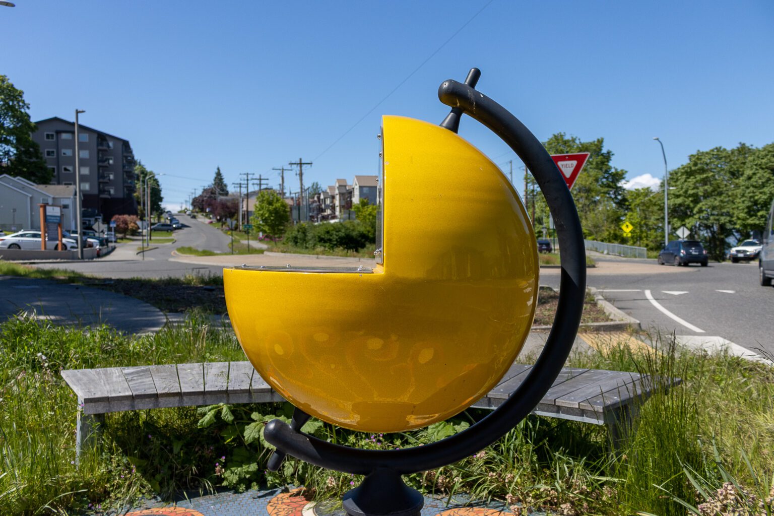 A sculpture of the sun sits by the roundabout on North State Street. From here
