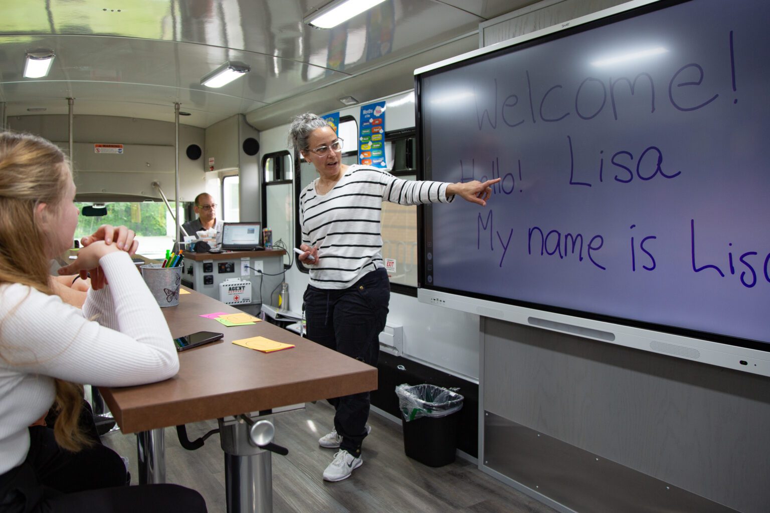 Lisa Brisbois teaches English to speakers of other languages aboard Evergreen Goodwill's Digital Equity Bus in June. Brisbois also teaches at Western Washington University and is headed to Latvia to instruct students on how to teach English in a 10-month fellowship.