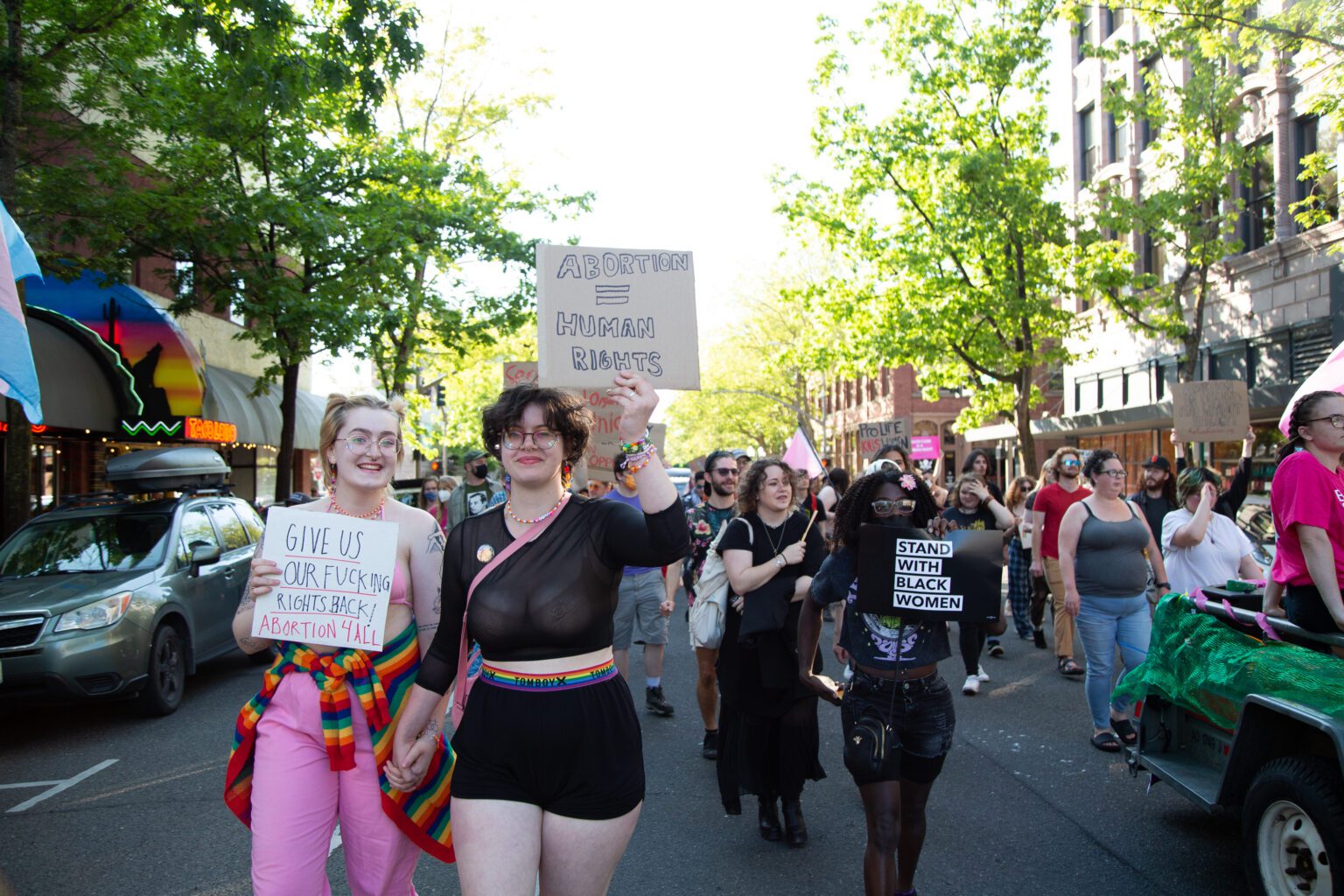 Dozens march straight down Magnolia Street carrying pro-abortion and Black Lives Matter signs on July 1. The group marched in honor of the Stonewall Riots from City Hall