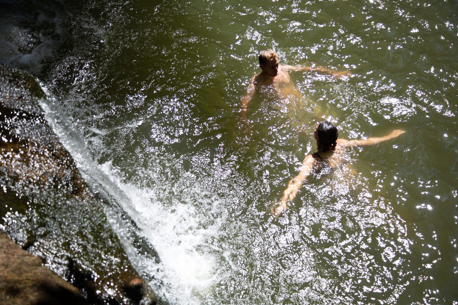 Michael Kretschmer and Emily Richter swim at Whatcom Falls Park on July 25.