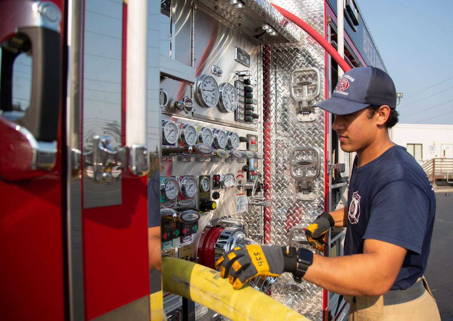 A Bellingham Fire Academy cadet runs drills on a fire engine in October 2022. Higher turnover and more need for training has been a factor in increased overtime costs in recent years at the Bellingham Fire Department.