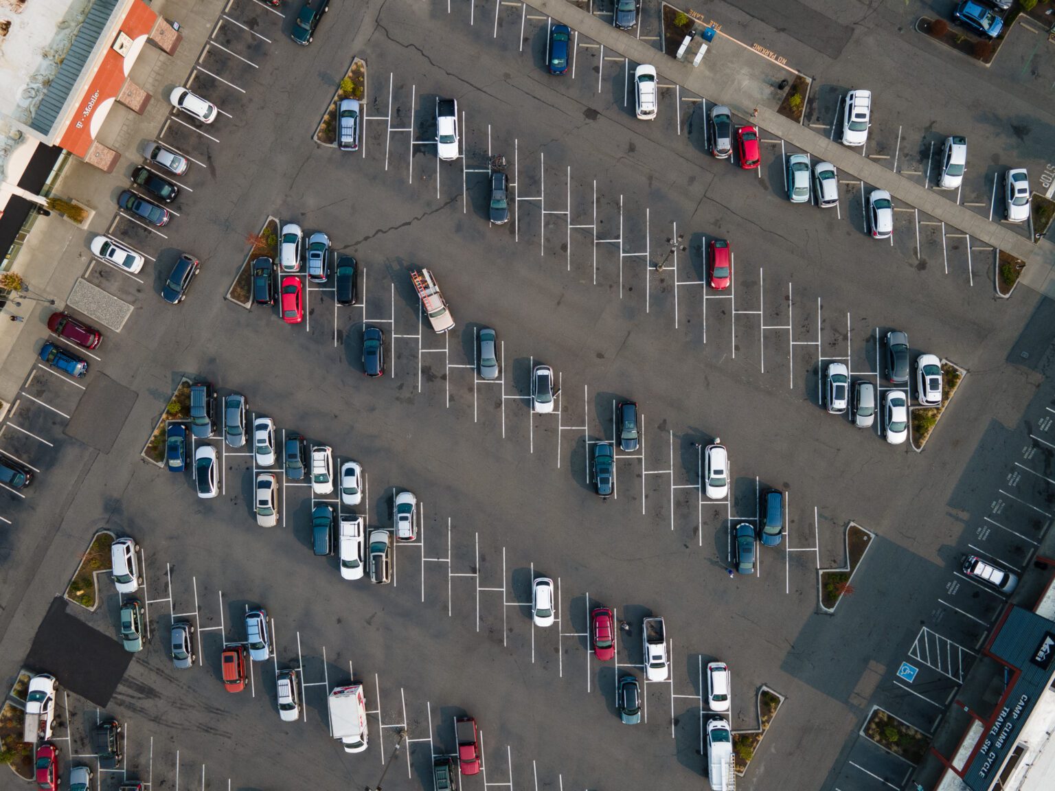 Cars fill the lot of the strip mall in Sehome on Oct. 18. Parking requirements for new developments are hindering growth of housing and having negative impacts on the environment