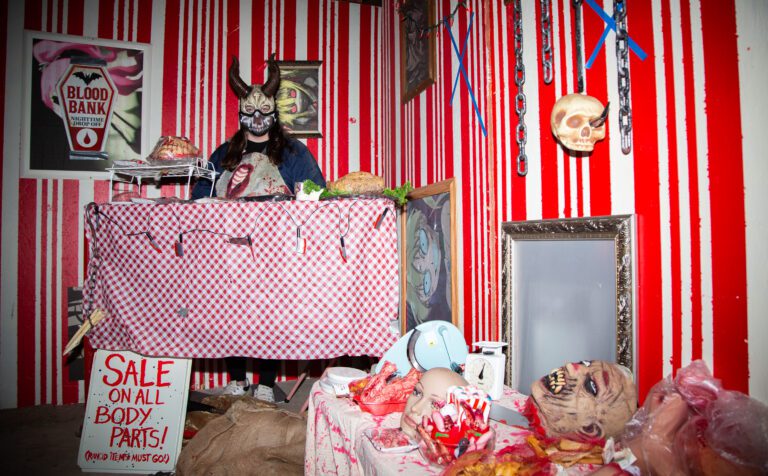 Finneas Towle waits for visitors to pass through the meat market in the Whatcom Frightmare Haunted House in Ferndale on Oct. 21. The annual event features "light scares" for kids and "full scares" — with the lights turned off and the monsters running amok.