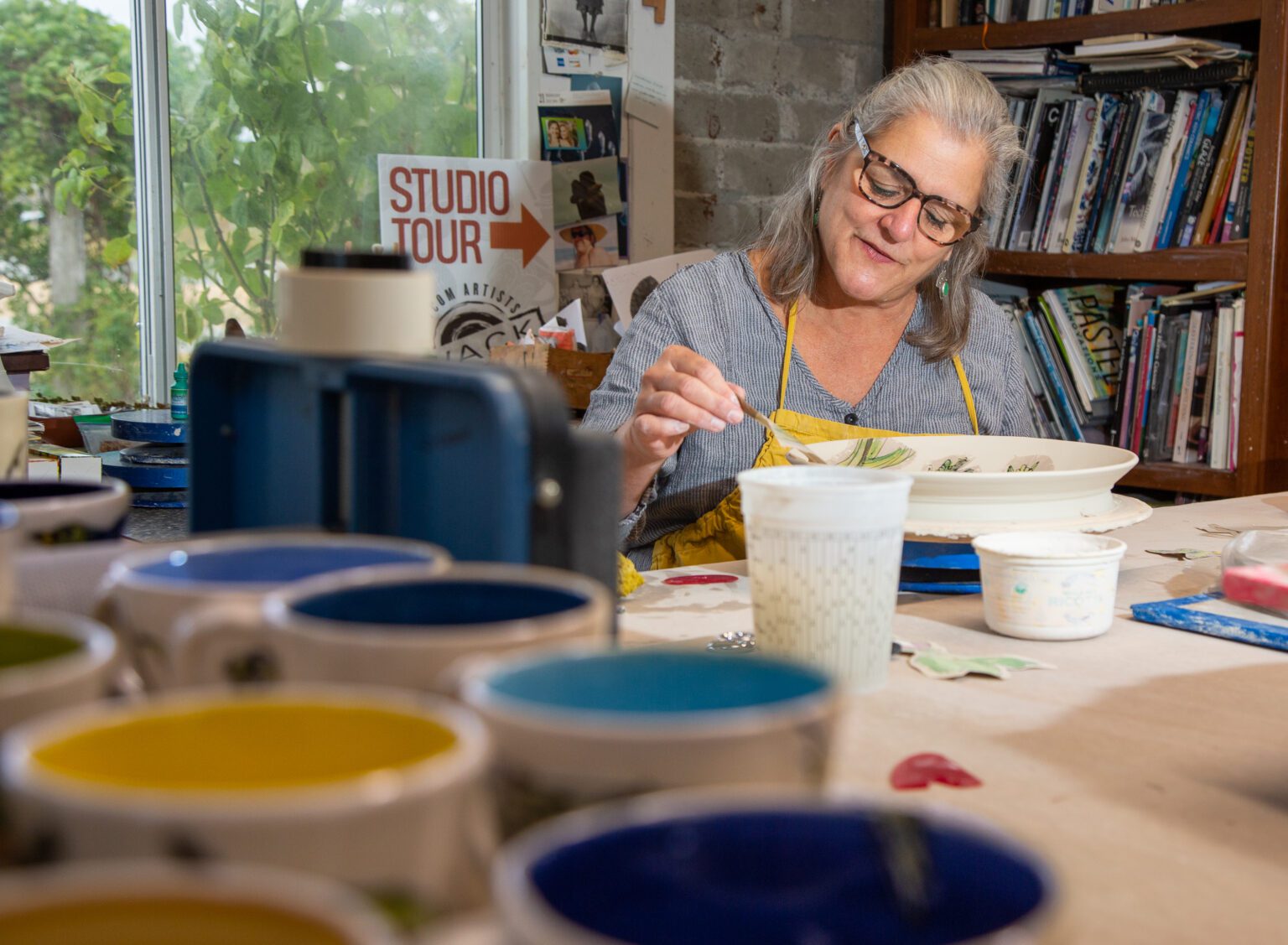 Ann Marie DeCollibus works on a plate in her home studio in Ferndale on Oct. 27. DeCollibus is a member of the Whatcom Artists of Clay & Kiln (WACK) and will be part of the WACK Studio Tour Nov. 5–6.