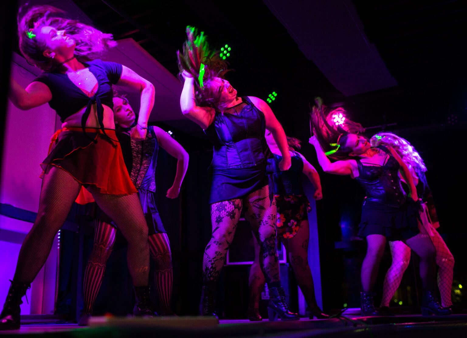 Risqué Renegades open the night at the Blue Room on Nov. 13. The burlesque dance troupe held a show to honor dancer Victoria Sprong Chue