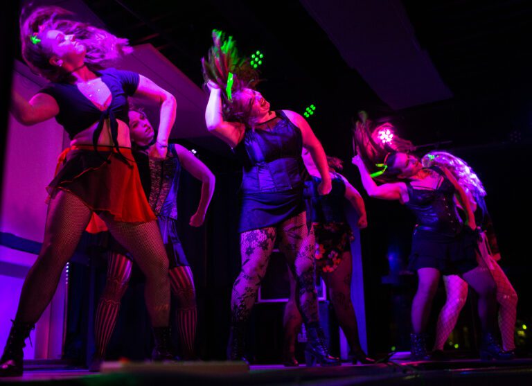 Risqué Renegades open the night at the Blue Room on Nov. 13. The burlesque dance troupe held a show to honor dancer Victoria Sprong Chue