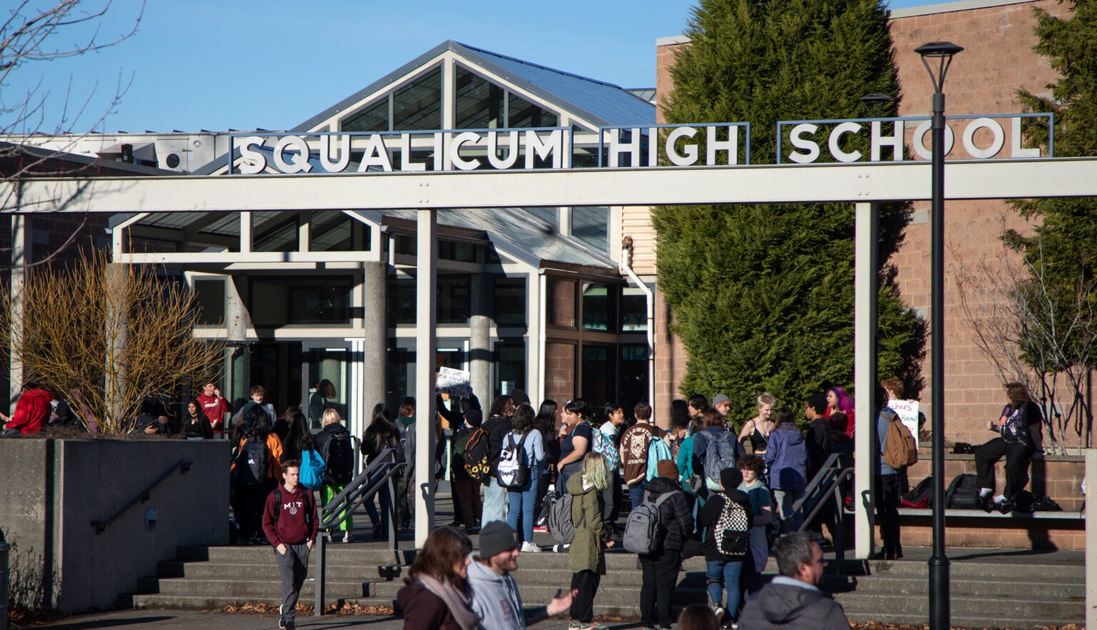 Student protesters stand outside Squalicum High School after crowds dispersed on Dec. 12. Hundreds of students walked out in protest of three Bellingham Public Schools assistant principals' alleged failure to report sexual assaults.