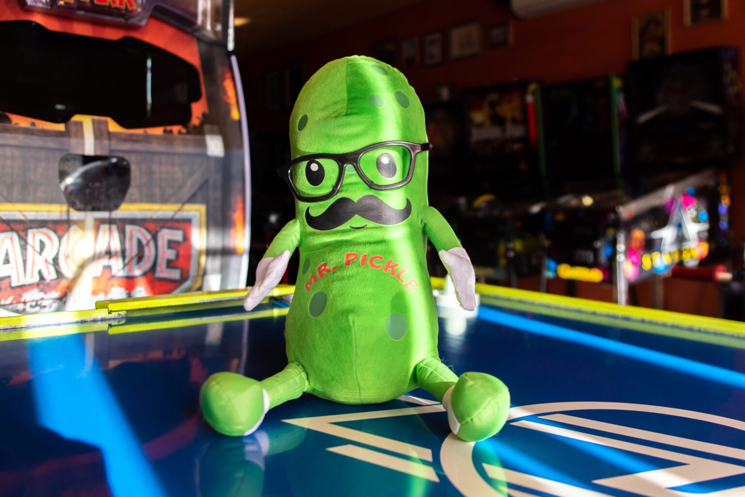 Mr. Pickle sits on an air hockey table Feb. 8 in The Ruckus Room. The pickle